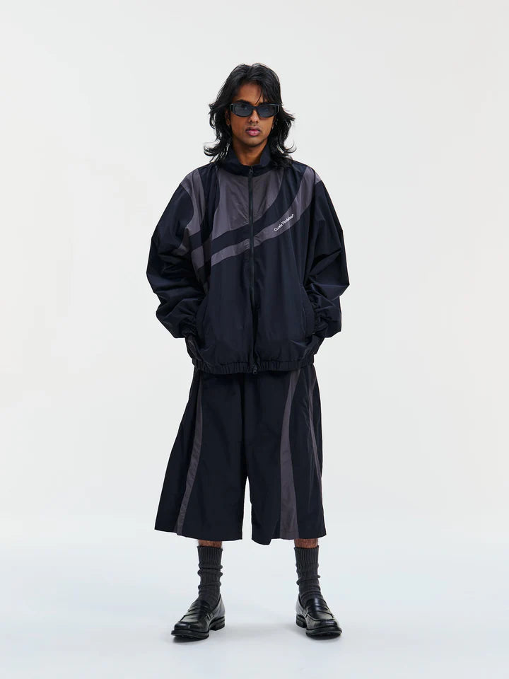 COOTIE | Nylon Paneling Shin Cut Wide Track Pants